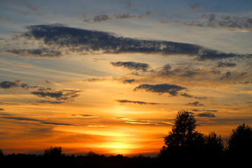 Fototapeta na wymiar Photo of a summer rural landscape with sunset