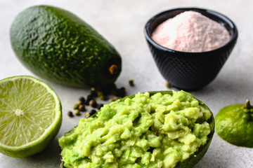 Traditional mexican dip - guacamole sauce with avocado, party food on table