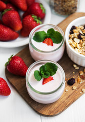 healthy breakfast, yogurt, fresh strawberries and granola