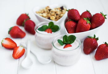 healthy breakfast, yogurt, fresh strawberries and granola