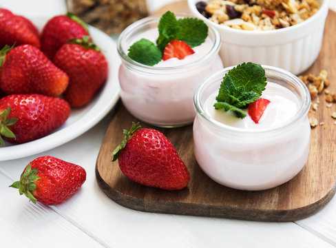 healthy breakfast, yogurt, fresh strawberries and granola