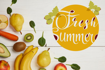 top view of fresh fruits and spinach leaves on white wooden background with copy space, fresh summer inscription