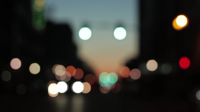 Driving through the city at night viewing the bokeh lights of cars and streetlights