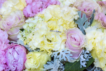 Wedding or Engagement Ring and Beautiful Bouquet of Flowers