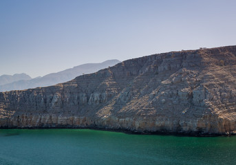 Fototapeta premium Sunrise in Muscat view from a Ship