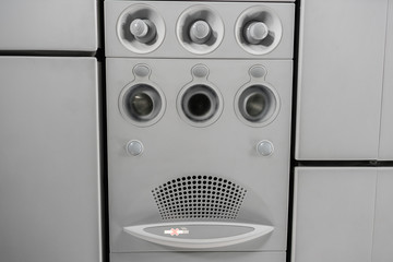 Air condition unit and lighting of aerospace on the ceiling of passenger cabin. Modern Airplane...
