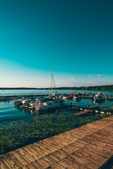 Fototapeta premium Boats in the bay against the sunset