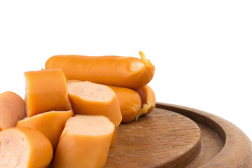 sausages slice on chopping board wood isolated on white background
