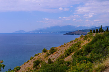Fototapeta premium panoramic sea and rocky mountains from the height of another hill. Place for extreme active rest
