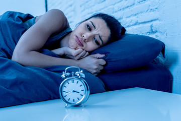 pretty latin woman can't sleep in insomnia concept