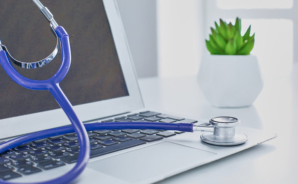 Stethoscope Lying On A Laptop Keyboard In A Concept Of Online Medicine Or Troubleshooting The Computer Viewed Low Angle With Copy Space