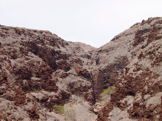 Red lava rock hillside on maui