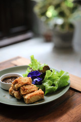 Vegan food appetizer japanese fried tofu on wood background vintage style
