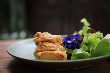 Vegan food appetizer japanese fried tofu on wood background vintage style