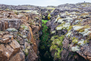 Fototapeta na wymiar Rock fissure seen from a route number 425 along shore of North Atlantic Ocean at Reykjanes Peninsula in Iceland