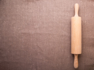 Baking ingredients. Flour, eggs, wheat and rolling pin on  table cloth. Rustic. Copy space