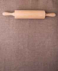 Baking ingredients. Flour, eggs, wheat and rolling pin on  table cloth. Rustic. Copy space