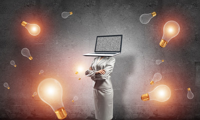 Business woman with laptop instead of head.