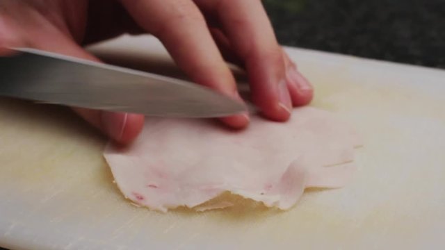 Man cutting Ham in the kitchen