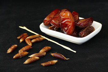 palm and palm kernel on a black background,
