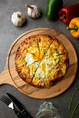 Pizza with egg ham and mushrooms