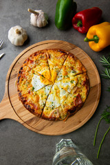 Pizza with egg ham and mushrooms