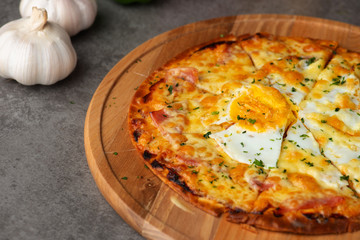 Pizza with egg ham and mushrooms
