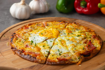 Pizza with egg ham and mushrooms