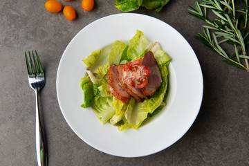 smoked duck salad on table