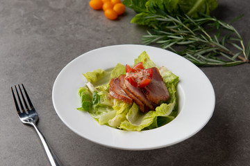 smoked duck salad on table