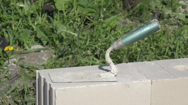 mason's trowel on masonry