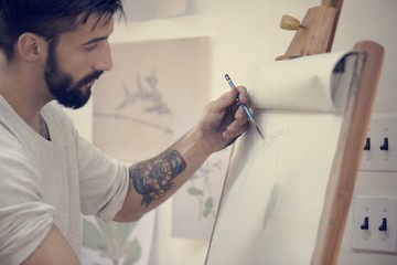 Man working on a painting
