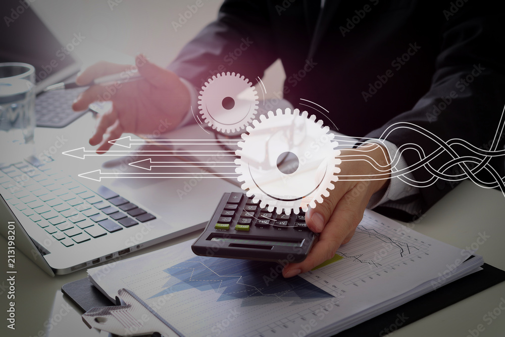 Aufkleber businessman hand working with finances about cost and calculator and latop with mobile phone on with