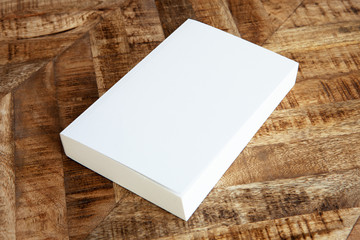 White empty book on vintage wooden background. 