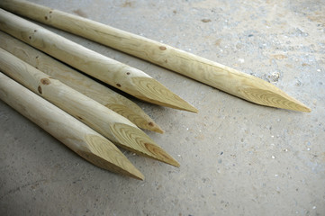 Stakes laying on concrete