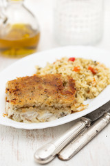 fried fish with garnish on dish