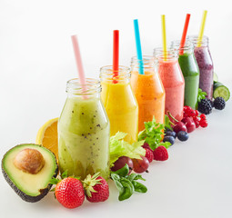 Different fresh fruit smoothies with ingredients