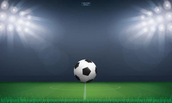 Soccer football ball on green grass of soccer field or football field stadium background. Vector.