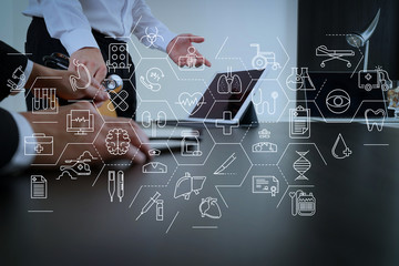 Medical co working concept,Doctor working with smart phone and digital tablet and laptop computer...