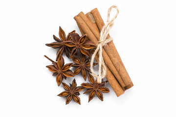 Cinnamon sticks and cardamom on a white background. Aromatic spices.