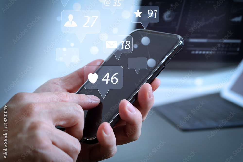 Poster close up of businessman hand working with mobile phone and laptop and digital tablet computer in modern office