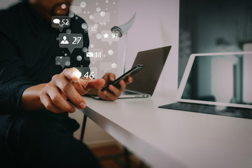 businessman working with smart phone and digital tablet and laptop computer in modern office