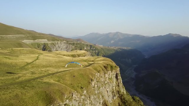 Aerial view. Paragliding in the mountains. Kazbegi, Georgia