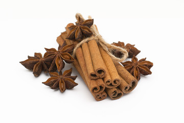 Cinnamon sticks and cardamom on a white background. Aromatic spices.