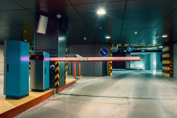 Entrance gate to underground garage parking lot, auto park interior inside