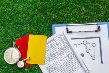 two penalty cards and a whistle for the referee