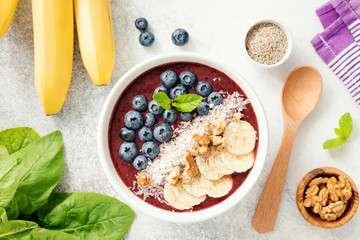 Acai smoothie bowl with blueberry, banana,walnut, coconut and chia seed. Vegan food, healthy eating and healthy lifestyle concept