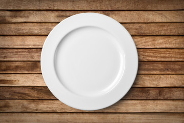 Empty plate on old wooden. Top view with clipping path.