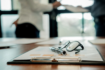 Business concept. Business people discussing the charts and graphs showing the results of their successful teamwork.