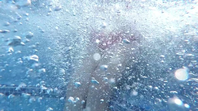 Professional video of beautiful legs of a young woman in a jacuzzi in slow motion 250fps